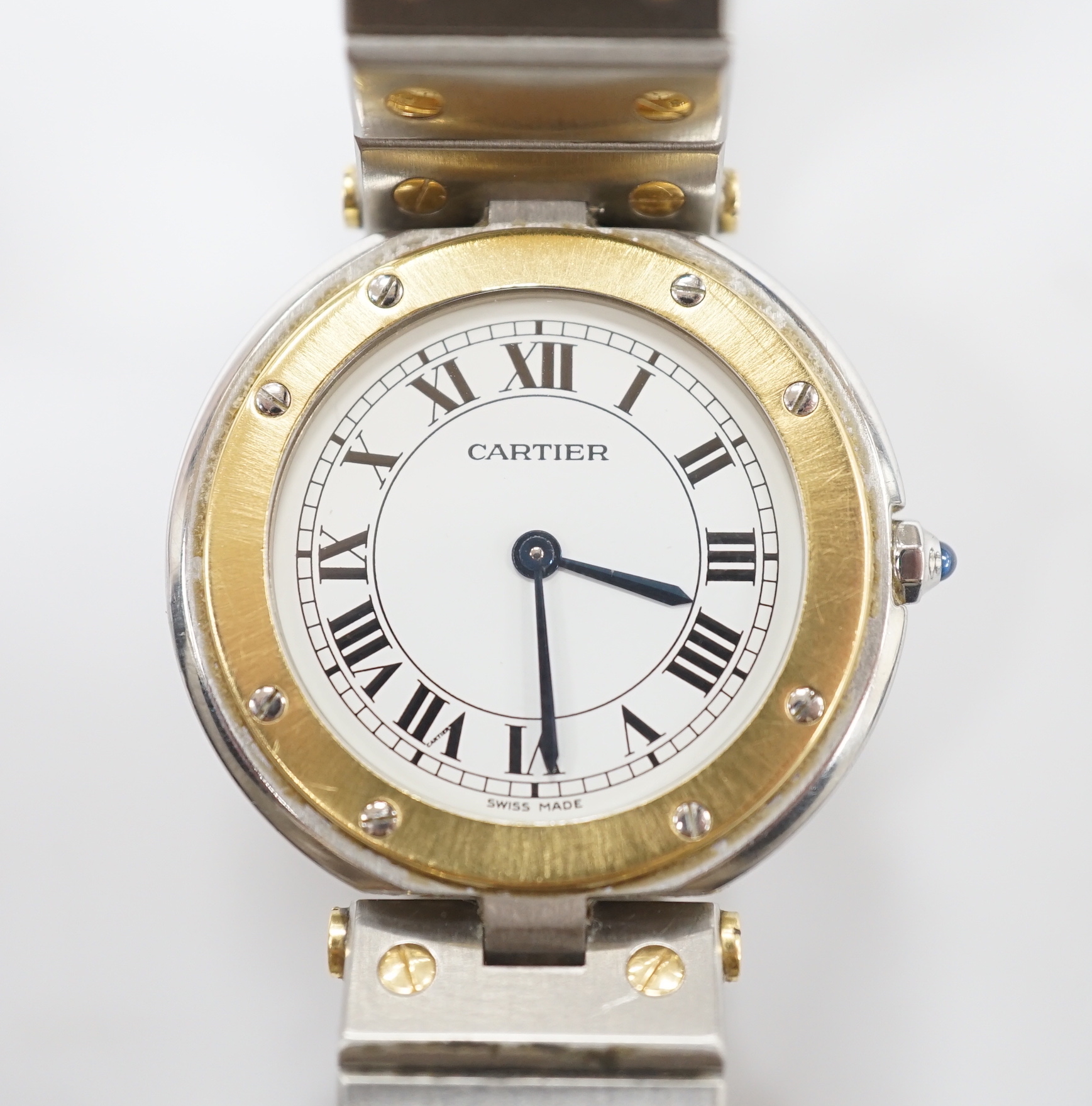 A steel and gold Cartier Ronde Vendom quartz wrist watch, with Roman dial, on a Cartier steel and gold bracelet, with Cartier pouch, no box or papers, case diameter 32mm.